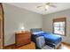 Inviting bedroom with a comfortable bed, wooden dresser, and a window with a view at 545 Walnut Woods Dr, Greenwood, IN 46142