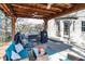 Outdoor patio featuring an outdoor kitchen, seating and ceiling fans at 545 Walnut Woods Dr, Greenwood, IN 46142