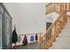 Grand foyer with a beautiful staircase and coat rack, perfect for welcoming guests at 545 Walnut Woods Dr, Greenwood, IN 46142