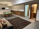 Basement game room boasts a pool table, wet bar, and comfortable seating area at 545 Walnut Woods Dr, Greenwood, IN 46142