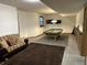 Spacious basement game room offers a pool table, seating area, and cozy atmosphere at 545 Walnut Woods Dr, Greenwood, IN 46142