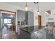Stylish kitchen featuring gray cabinetry, an island with storage, and open access to the dining and living areas at 545 Walnut Woods Dr, Greenwood, IN 46142