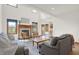 Bright living room with a cozy fireplace, large windows, and hardwood floors at 545 Walnut Woods Dr, Greenwood, IN 46142