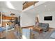 Open-concept living room flows into a kitchen, offering seamless entertaining space at 545 Walnut Woods Dr, Greenwood, IN 46142