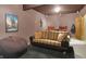 Finished basement media room offers cozy seating, a large screen, and stylish decor at 545 Walnut Woods Dr, Greenwood, IN 46142