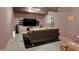Basement media room with a large screen TV, comfortable seating, and modern design at 545 Walnut Woods Dr, Greenwood, IN 46142