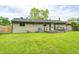 Expansive backyard with lush green grass and mature trees for outdoor enjoyment at 5558 Bertha St, Indianapolis, IN 46241