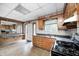 Well-lit kitchen area featuring wood cabinets, and a stainless-steel gas range at 5558 Bertha St, Indianapolis, IN 46241