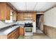 Spacious kitchen with plenty of cabinet space, a gas range, and an open layout at 5558 Bertha St, Indianapolis, IN 46241