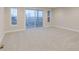 Carpeted bedroom with large sliding doors leading to an outdoor space, offering a serene view at 5790 Arcade Blvd, McCordsville, IN 46055