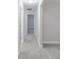 Spacious hallway with carpet and multiple door access to bedrooms and a walk-in closet at 5790 Arcade Blvd, McCordsville, IN 46055