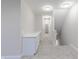 Well-lit hallway with plush carpeting and convenient built-in cabinetry at 5790 Arcade Blvd, McCordsville, IN 46055