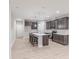 Well-lit kitchen featuring modern appliances, center island with sink and barstool seating at 5790 Arcade Blvd, McCordsville, IN 46055