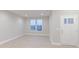 Bright and airy living room showcasing neutral walls, white trim, and wood-look flooring at 5790 Arcade Blvd, McCordsville, IN 46055