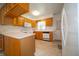 Functional kitchen featuring white appliances, light countertops, and ample cabinet space at 5903 Schoolwood Dr, Speedway, IN 46224