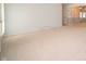 Bright and airy living room with carpeting and views into adjoining rooms at 5903 Schoolwood Dr, Speedway, IN 46224