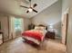Comfortable bedroom with ceiling fan, neutral colors, and large windows at 6366 Stratford N Dr, Fishers, IN 46038
