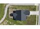 An aerial view of a house with a two-car garage and black roof at 637 N Quartz Ln, Fortville, IN 46040