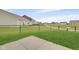 Backyard with a black fence and common area with playground at 637 N Quartz Ln, Fortville, IN 46040