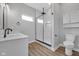 Bright bathroom with walk-in shower, quartz countertop, and modern fixtures at 637 N Quartz Ln, Fortville, IN 46040
