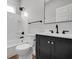 Stylish bathroom with a dark vanity and white shower-tub combo at 637 N Quartz Ln, Fortville, IN 46040