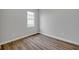 Empty bedroom featuring LVP flooring and a bright window at 637 N Quartz Ln, Fortville, IN 46040