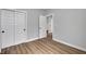 Spacious bedroom with luxury vinyl flooring and a closet at 637 N Quartz Ln, Fortville, IN 46040