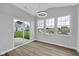 Bright dining area with many windows and view of the backyard at 637 N Quartz Ln, Fortville, IN 46040
