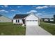 A charming home featuring a mix of siding and brick accents, complemented by an attached two-car garage and a well-kept lawn at 637 N Quartz Ln, Fortville, IN 46040