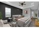 Tranquil main bedroom offers a decorative wall, accent furniture, and a ceiling fan at 637 N Quartz Ln, Fortville, IN 46040