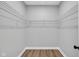 Walk-in closet with wire shelving and wood flooring at 637 N Quartz Ln, Fortville, IN 46040