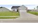 Charming single Gathering home with a large front yard and two car garage with ample parking at 637 N Quartz Ln, Fortville, IN 46040