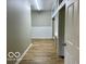Open basement hallway with an open door at 6373 E Hadley Rd, Mooresville, IN 46158