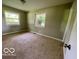 Neutral bedroom with natural light from two windows at 6373 E Hadley Rd, Mooresville, IN 46158