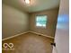 Empty bedroom featuring carpet and a bright window at 6373 E Hadley Rd, Mooresville, IN 46158
