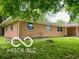 A quaint single-story home featuring a brick exterior and ample windows at 6373 E Hadley Rd, Mooresville, IN 46158