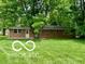 Single story brick home situated on a green lawn at 6373 E Hadley Rd, Mooresville, IN 46158