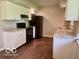 Functional kitchen featuring ample counter space, black appliances, and hardwood floors at 6373 E Hadley Rd, Mooresville, IN 46158