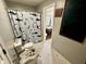 Functional bathroom features a shark-themed shower curtain and tiled flooring at 6640 Sundown S Dr, Indianapolis, IN 46254
