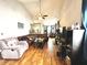 Spacious living room with hardwood floors, ample seating, and a ceiling fan at 6640 Sundown S Dr, Indianapolis, IN 46254
