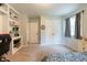 Bedroom with carpet, built-in bookcase, window, and closet providing ample space and natural light at 6799 Lakeshore Dr, Avon, IN 46123