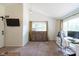This home office features a lovely light fixture, a comfortable chair, and a great view at 6799 Lakeshore Dr, Avon, IN 46123