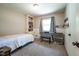 Bedroom with built-in shelving, carpet and a window for natural light creating a comfortable atmosphere at 6799 Lakeshore Dr, Avon, IN 46123