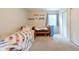 This bedroom includes two beds, great natural light, and unique decor at 6799 Lakeshore Dr, Avon, IN 46123
