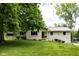 Charming single-story home with a well-manicured lawn and established landscaping at 6799 Lakeshore Dr, Avon, IN 46123