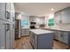 Stylish kitchen featuring gray cabinets, stainless steel appliances, and a functional island at 6799 Lakeshore Dr, Avon, IN 46123