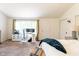 Bright main bedroom with a dedicated desk and work area next to a large window at 6799 Lakeshore Dr, Avon, IN 46123