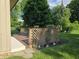Backyard featuring a wooden deck with lattice railing and manicured lawn at 7015 Westlake Rd, Indianapolis, IN 46214