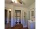 This bedroom features a hardwood floor, private bathroom, shower stall, and mirrored closet at 7015 Westlake Rd, Indianapolis, IN 46214