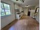 Kitchen featuring white appliances, white cabinetry and a ceiling fan at 7015 Westlake Rd, Indianapolis, IN 46214
